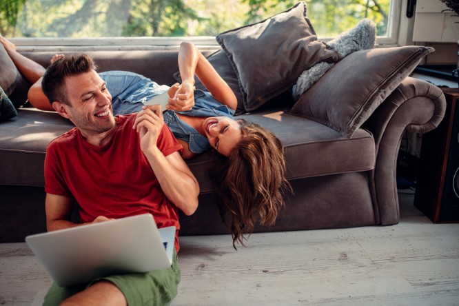 Man and woman shopping online