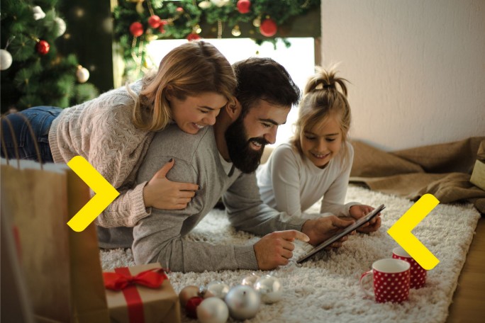 Family in their home looking at their phone and searching about bank's loans