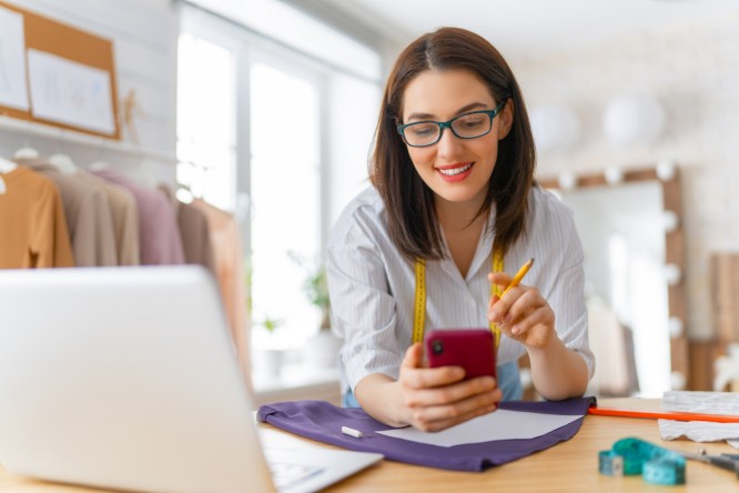 Woman is working at workshop. Concept of small business.