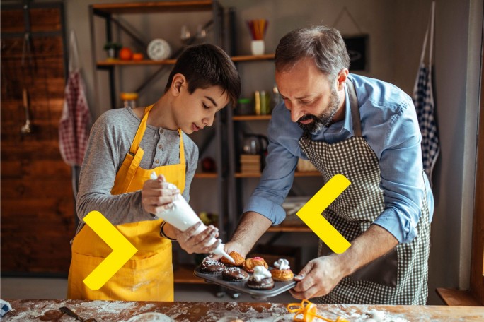 A father and son baking together, representing the joy of planning for the future by opening a Raiffeisen Bank account online.